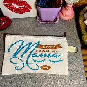 Small white canvas makeup bag with zipper and keychain ring. 💋